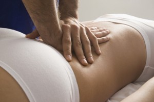 Chiropractor adjusting womanÕs back